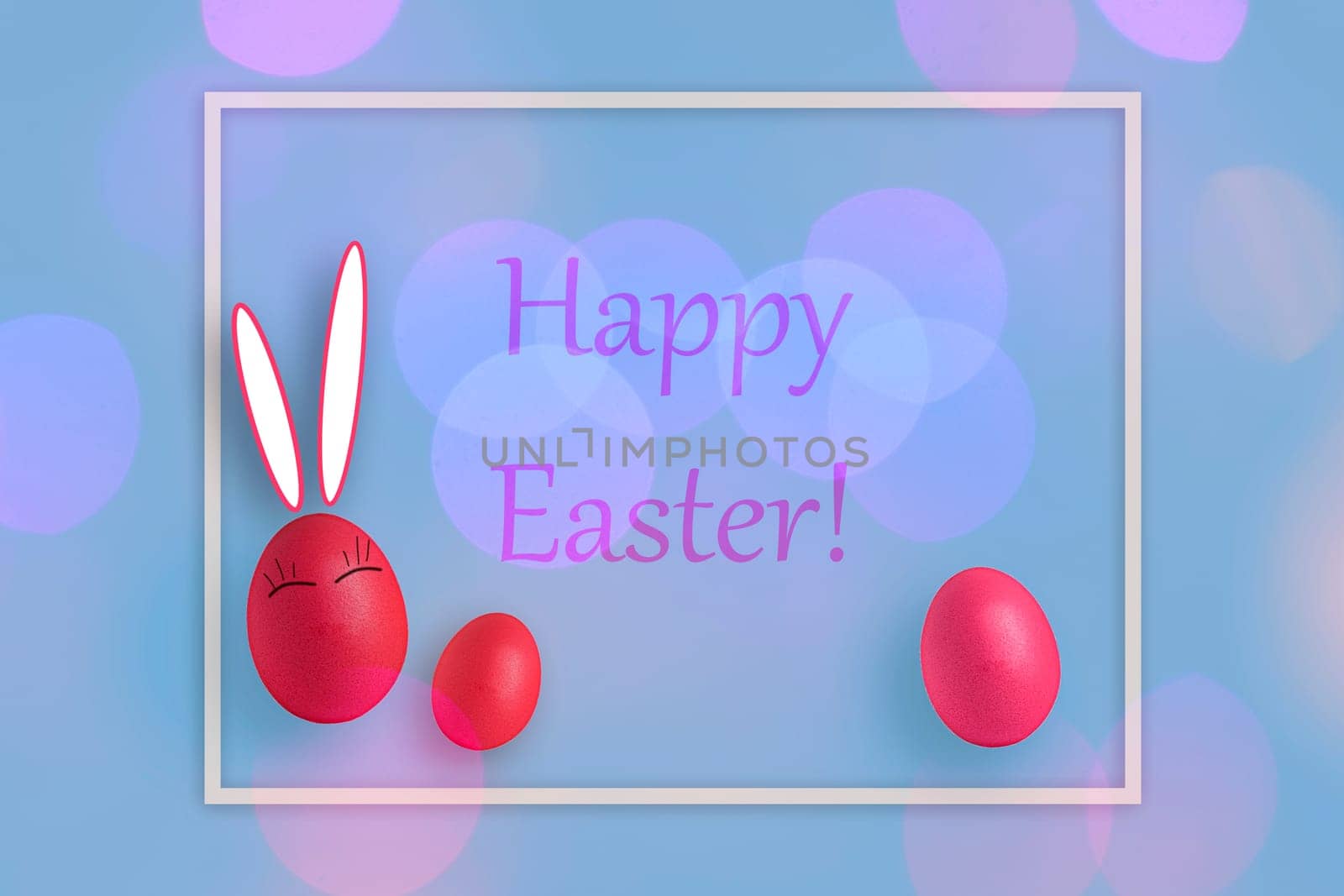 Composition in frame with Easter eggs and on pink background.