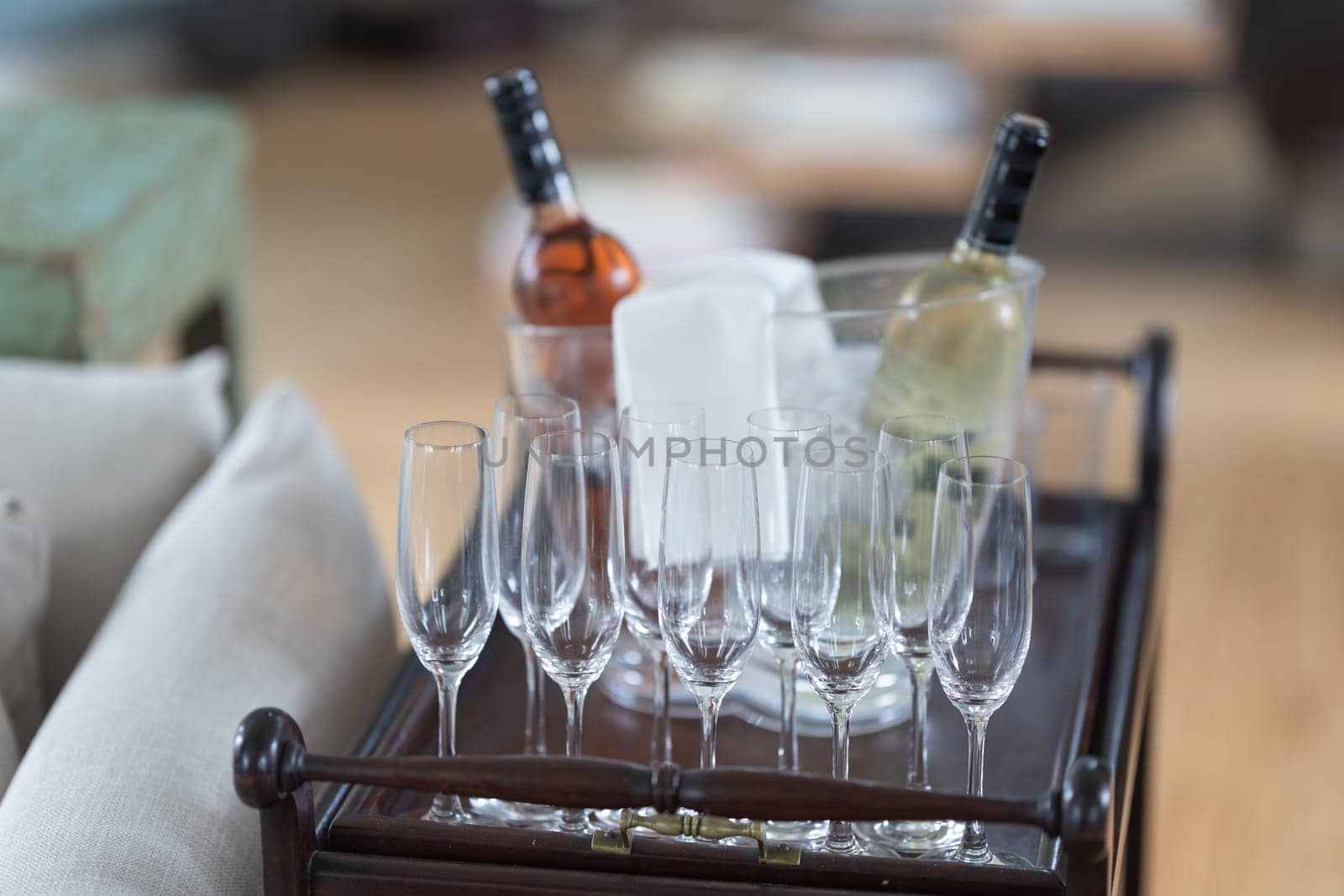 A tray of wine glasses and a bottle of wine by Studia72