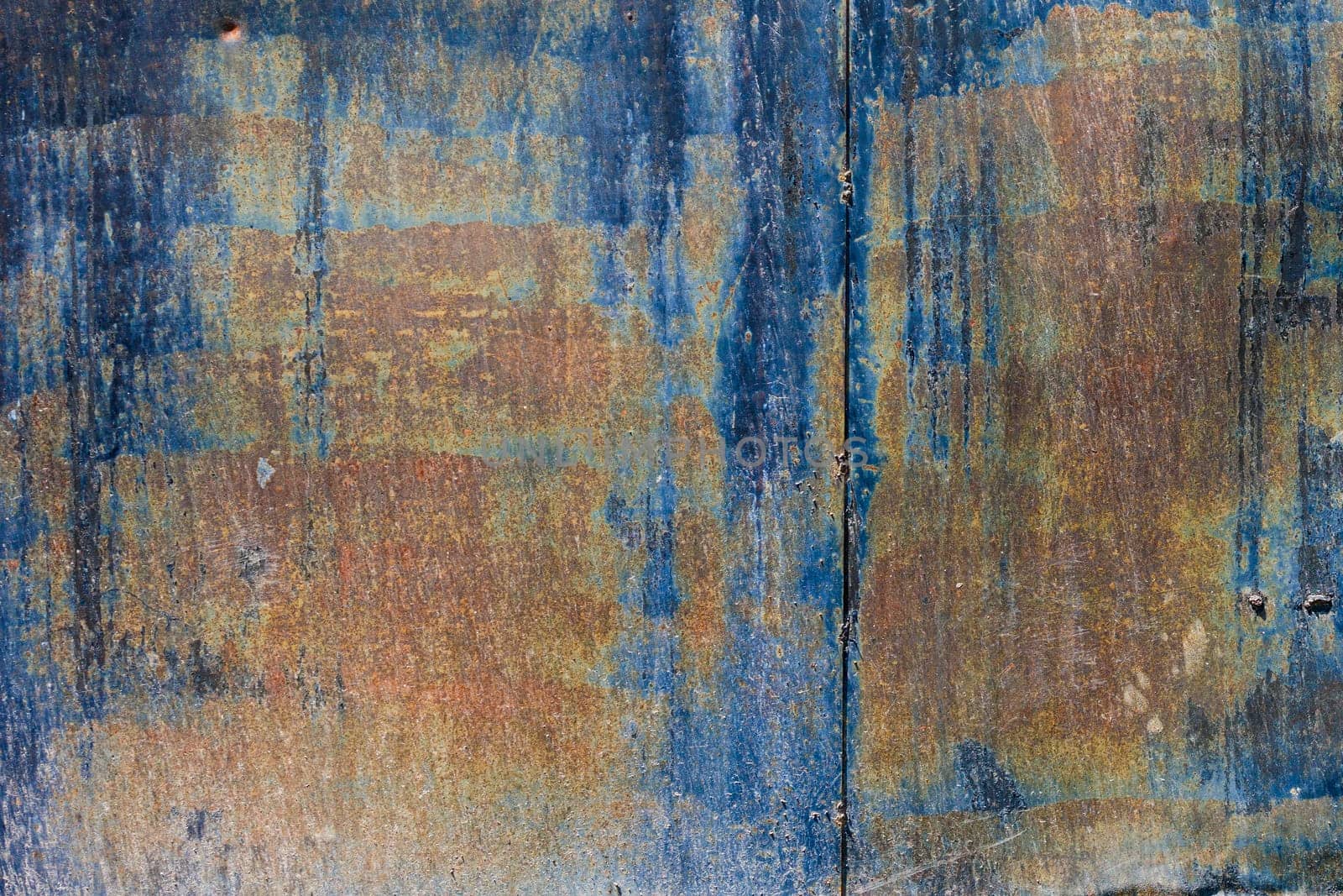 rough dark-blue sun faded flat vertical sheet metal surface with thin rust by z1b