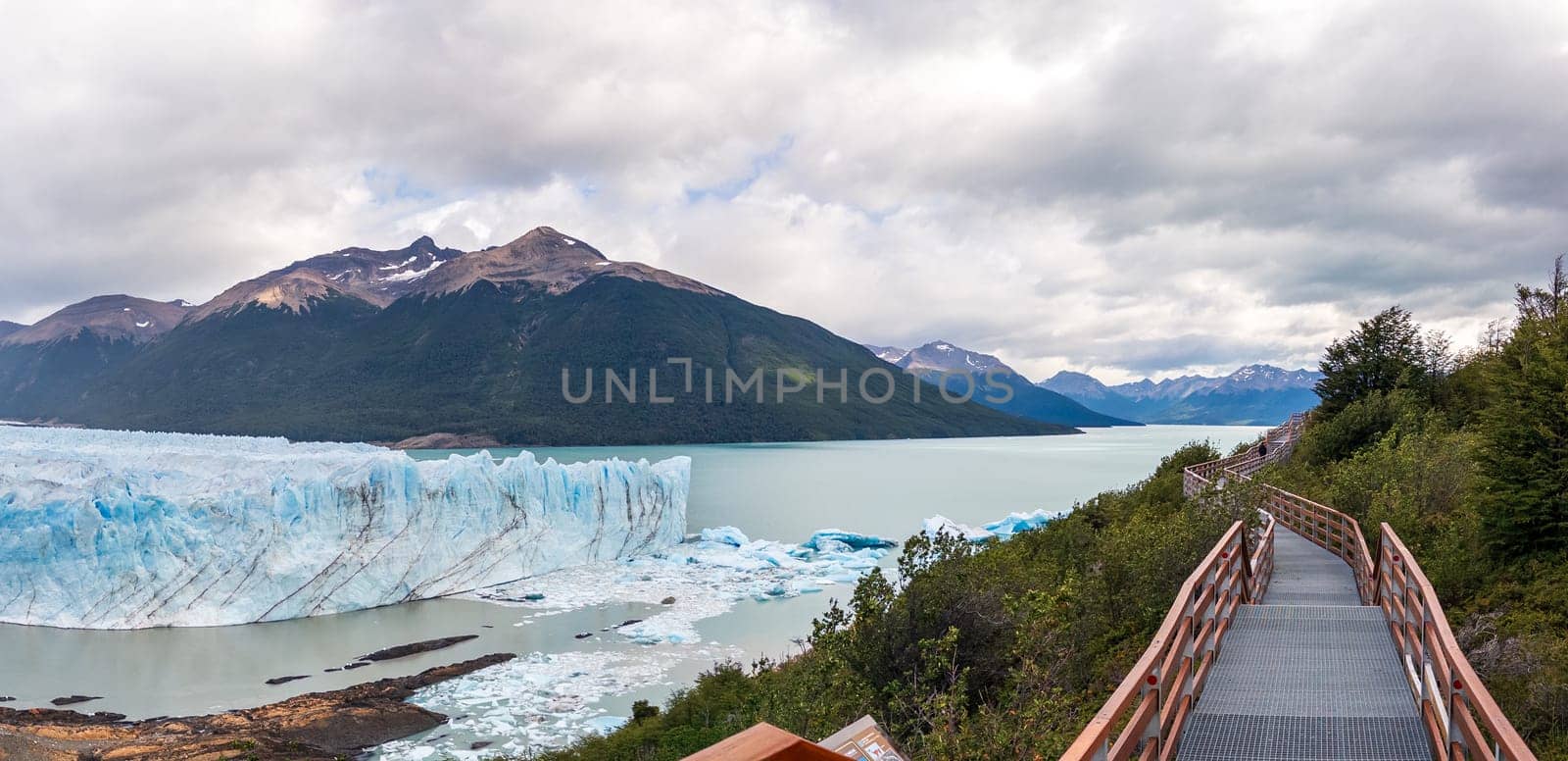 Panoramic View of a Glacier and Lake in Mountainous Landscape by FerradalFCG