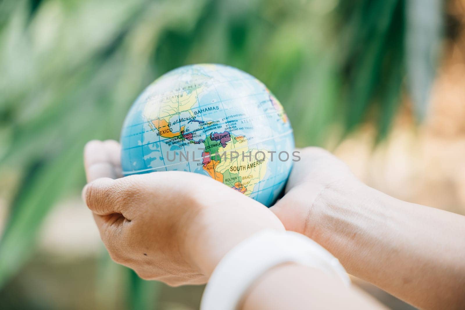 Celebrate Environment and Earth Day by embracing the Green Planet in your hands, symbolizing responsibility, wisdom, and global support for Earth's well-being.