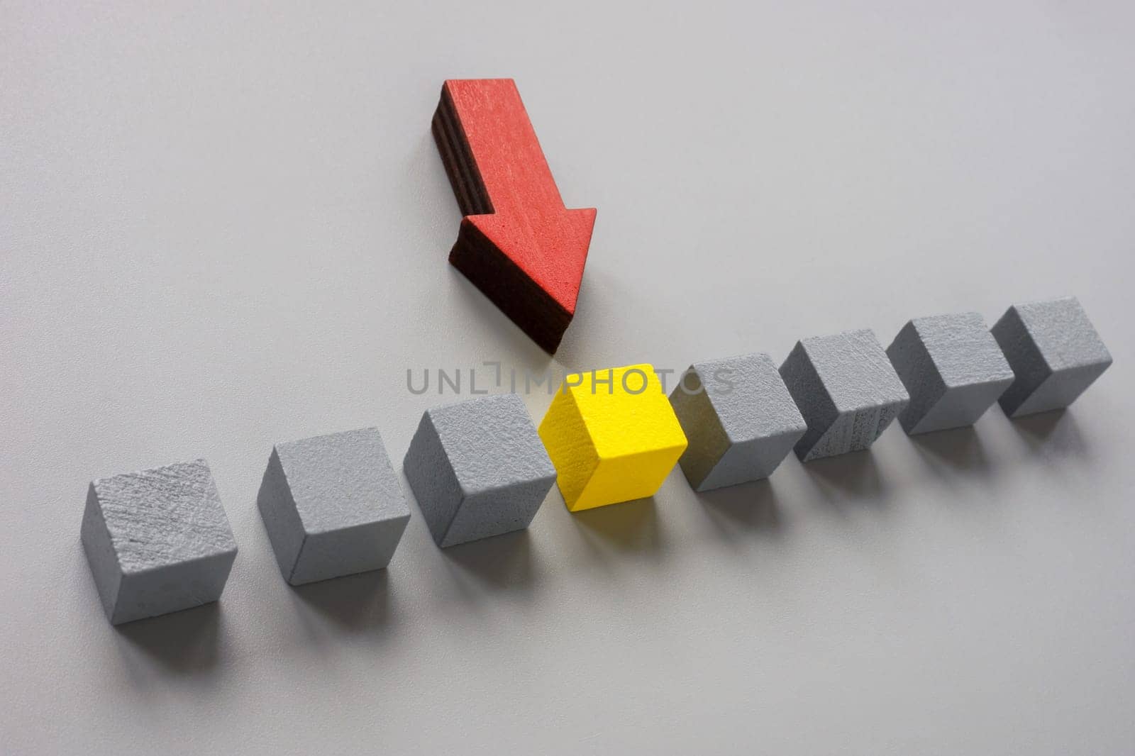 Gray cubes with yellow selected. Talent search, recruiting or personnel selection. by designer491