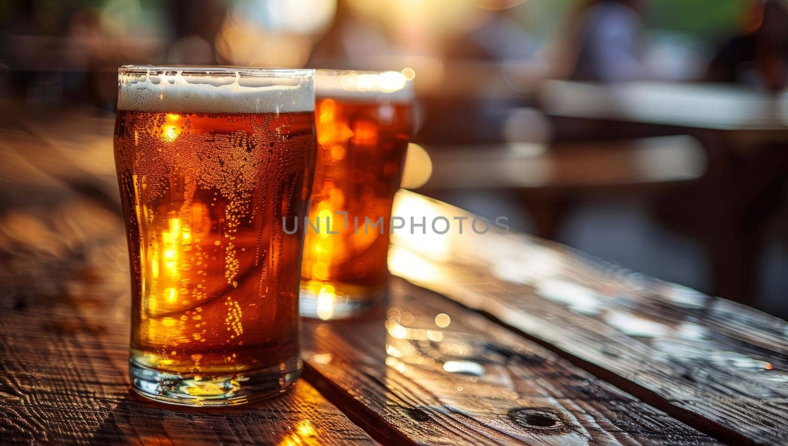 Two glasses of cold craft beer on rustic wooden table in pub or bar. Refreshing amber ale or lager in pint glasses, perfect for unwinding after work or on weekend