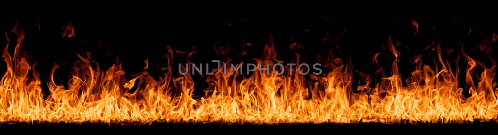 Hell flames, devil's mouth. fire banner. A background of scalding flames. Firestorm. Fire burning. Bright burning flames on a black background. Wall of Real fire, abstract background. Fire flames.