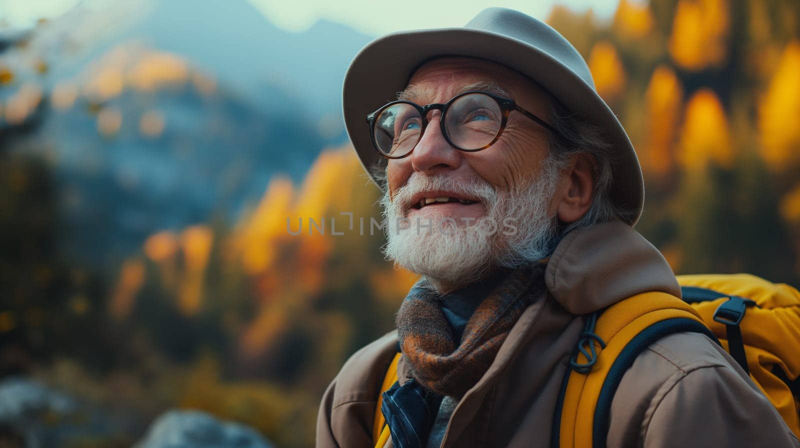Senior Hiker Enjoying the Autumn Mountains at Sunset by chrisroll