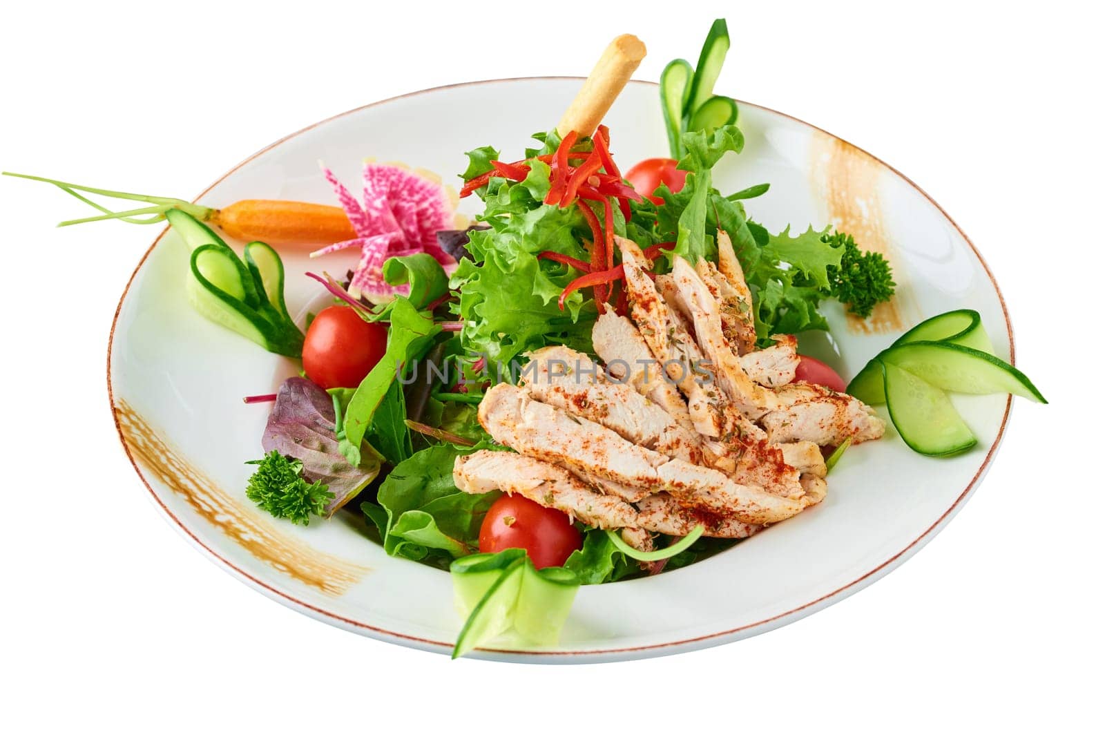 Fresh salad with grilled chicken breast, arugula and tomato. Top view