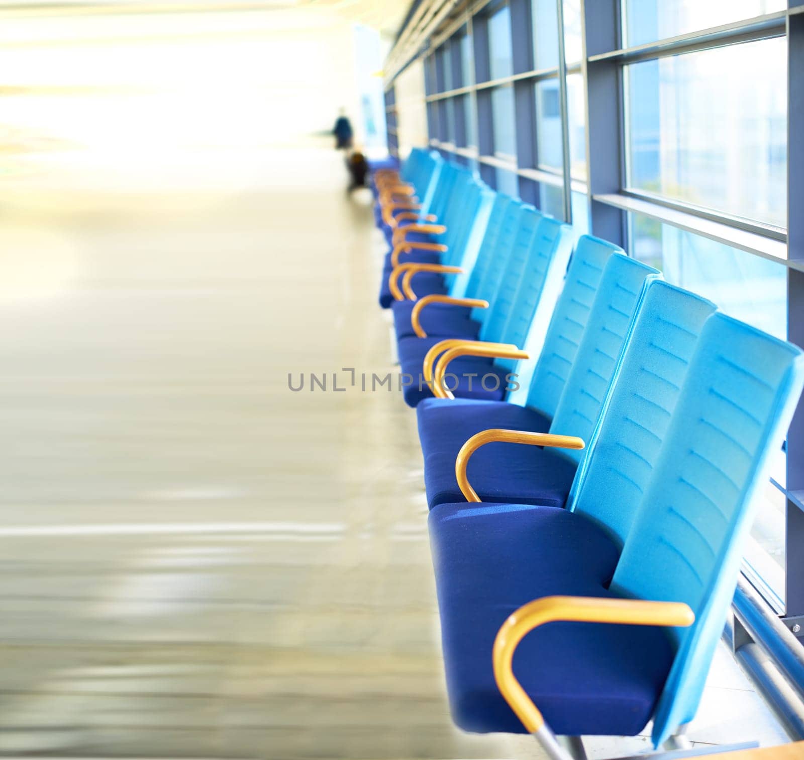 Chair, row and interior in airport for travel, aircraft and flight in building with design in futuristic architecture. Modern, urban and editorial with walls for movement, destination and travelers by YuriArcurs