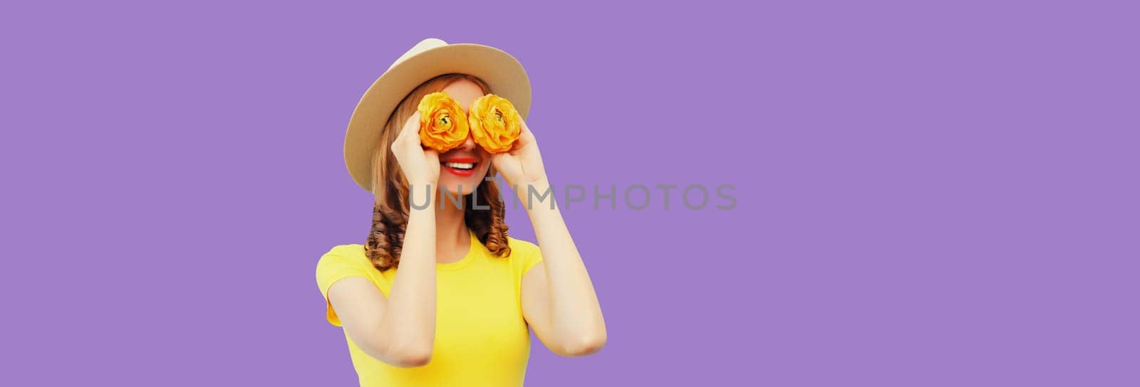 Summer portrait of happy woman with flower buds looking for something on purple studio background by Rohappy