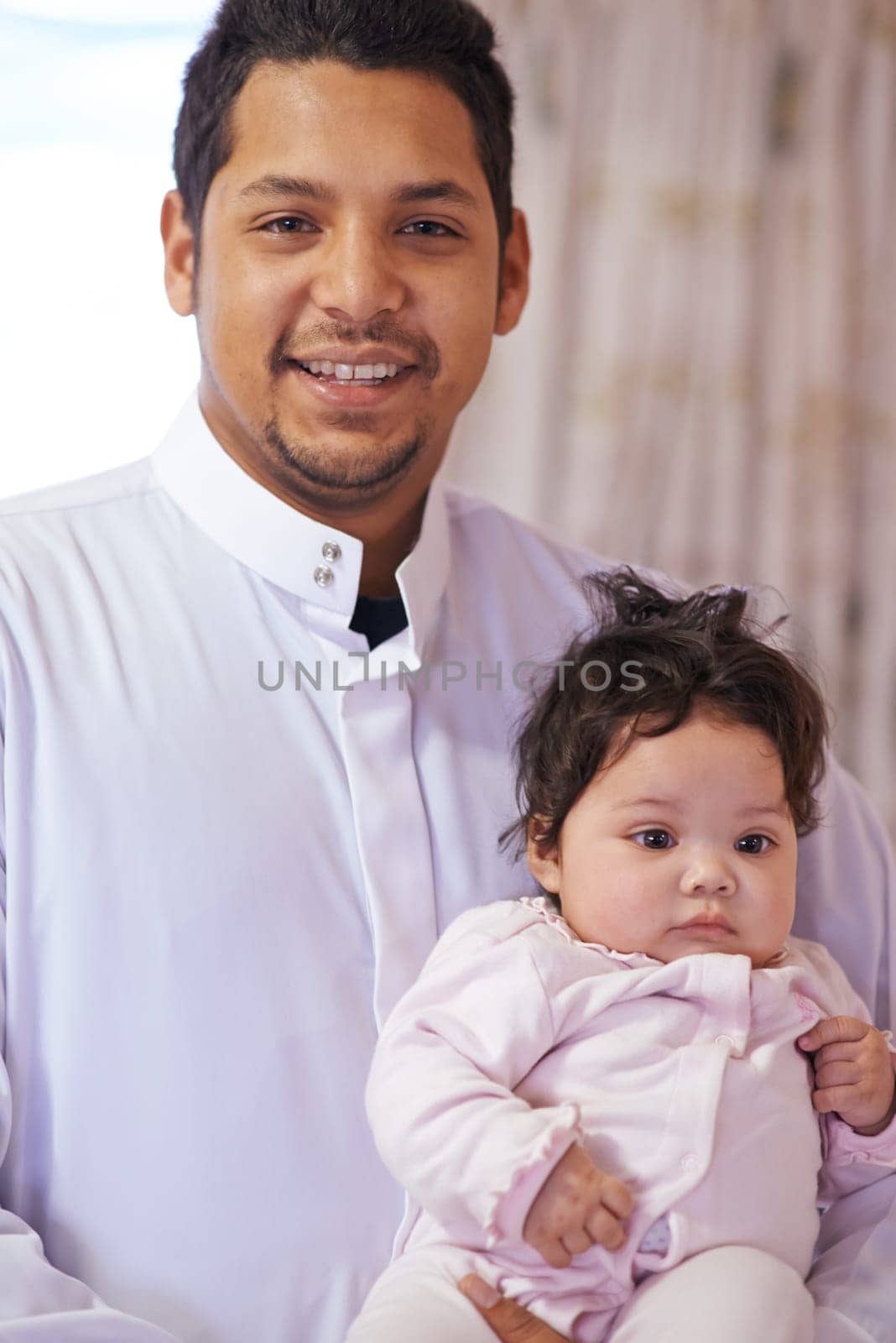 Muslim, family and portrait of dad with baby in home for bonding, relationship and calm together. Parenting, happy and Islamic father with newborn infant for love, childcare or support in living room by YuriArcurs