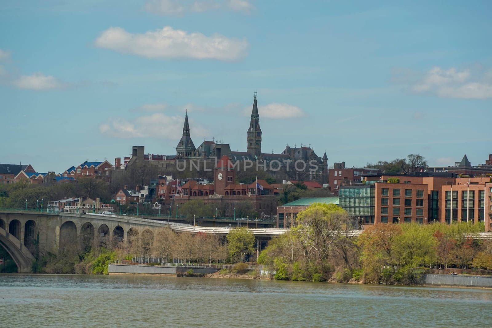georgetown view from cruise on potomac river washignton dc on riverboat water taxi by AndreaIzzotti