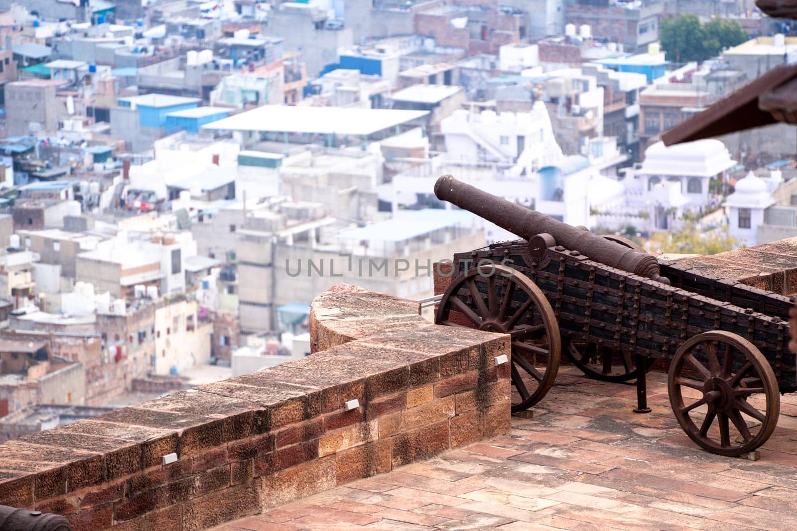 Ancient cannon with sheels shooting over the city of Jodhpur jaipur udaipur jaisalmer showing the fortifications and defences of ancient forts in Rajasthan India