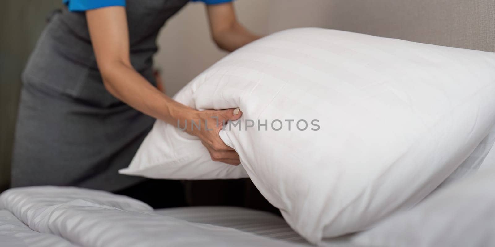 Woman staff cleaning service for work. young female cleaner a bedroom.