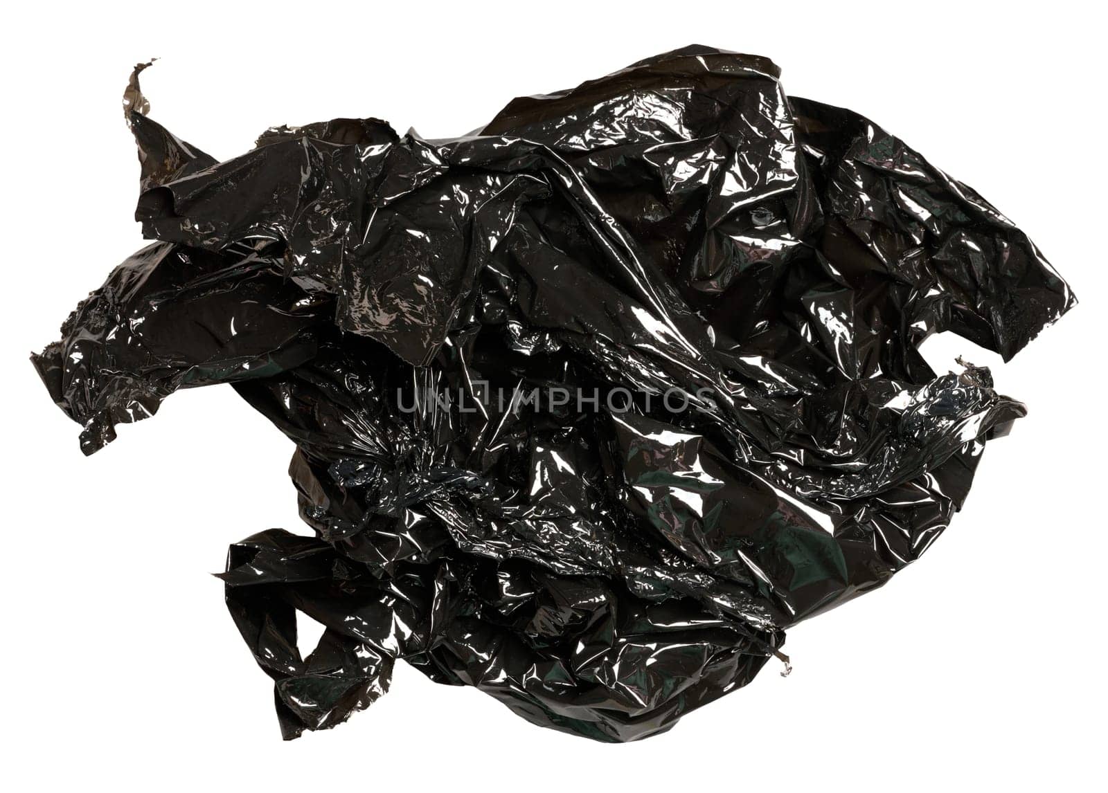 Crumpled piece of black polyethylene on isolated background by ndanko