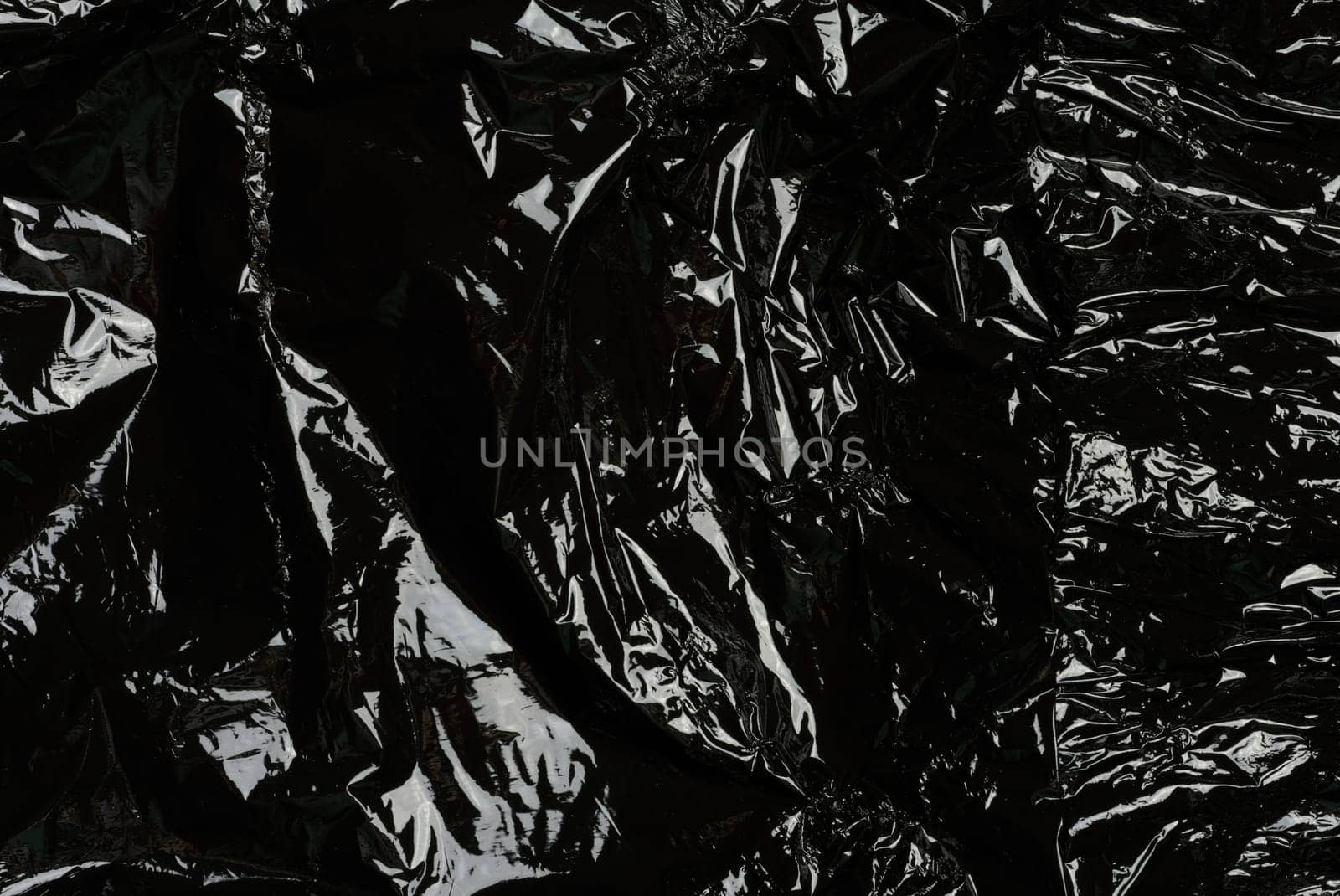 Crumpled black polyethylene, full frame