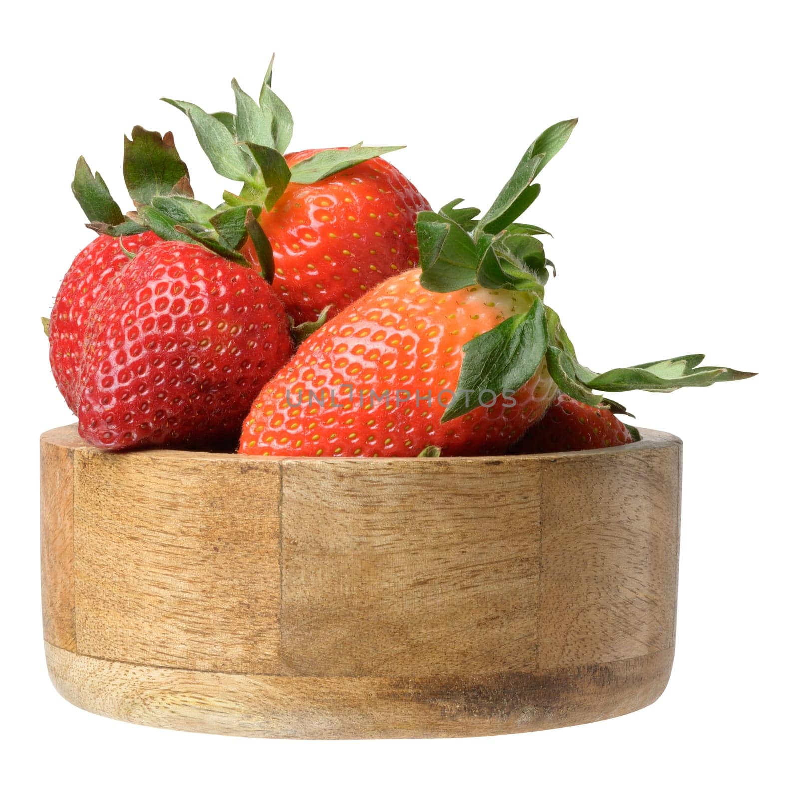 Ripe red strawberries in a wooden bowl on an isolated background