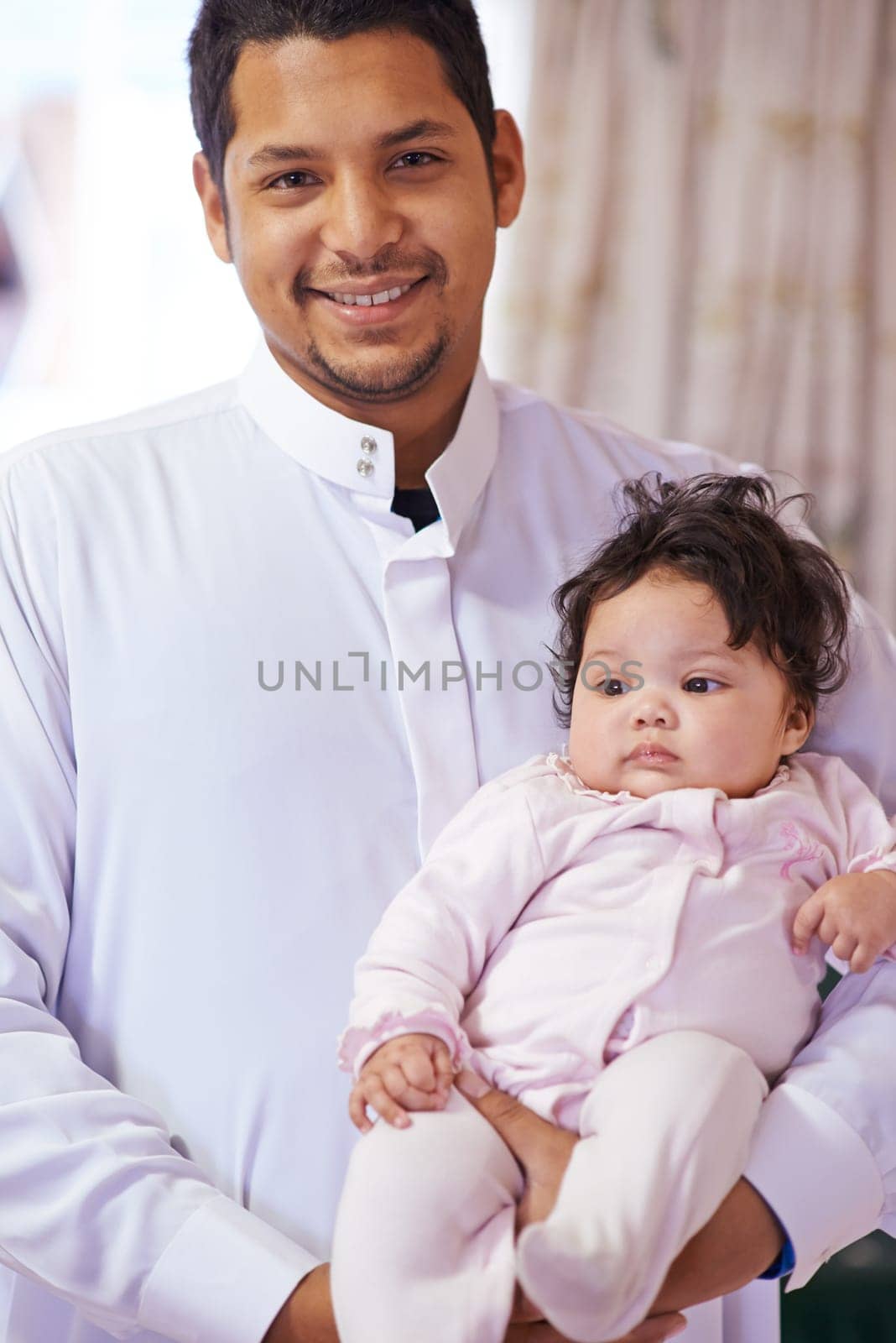 Muslim, family and portrait of father with baby in home for bonding, relationship and calm together. Parenting, happy and Islamic dad with newborn infant for love, childcare or support in living room by YuriArcurs