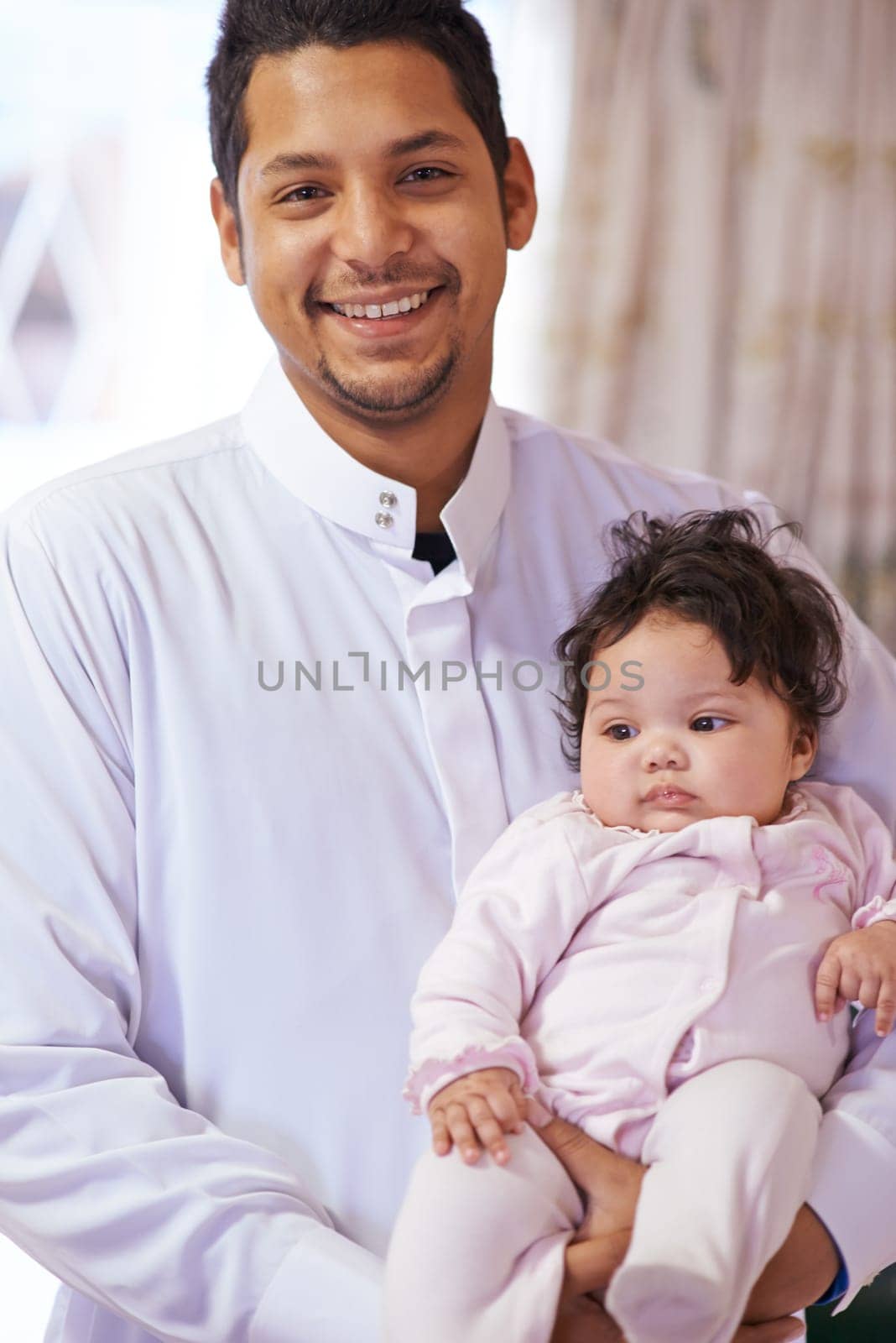Muslim, happy and portrait of father with baby in home for bonding, relationship and calm together. Parenting, family and Islamic dad with newborn infant for love, childcare or support in living room.