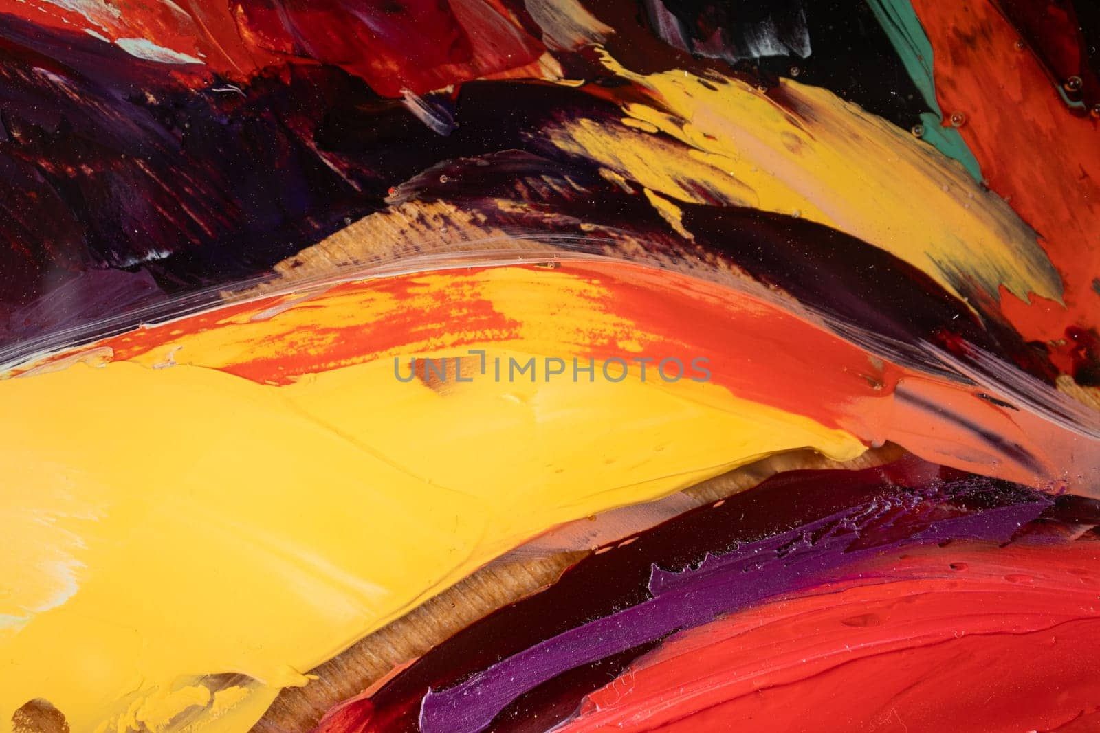 Fragment of multicolored texture painting on plywood. Abstract art background. oil on canvas. Rough brushstrokes of paint. Closeup of a painting by oil and palette knife. Highly-textured, high quality details.