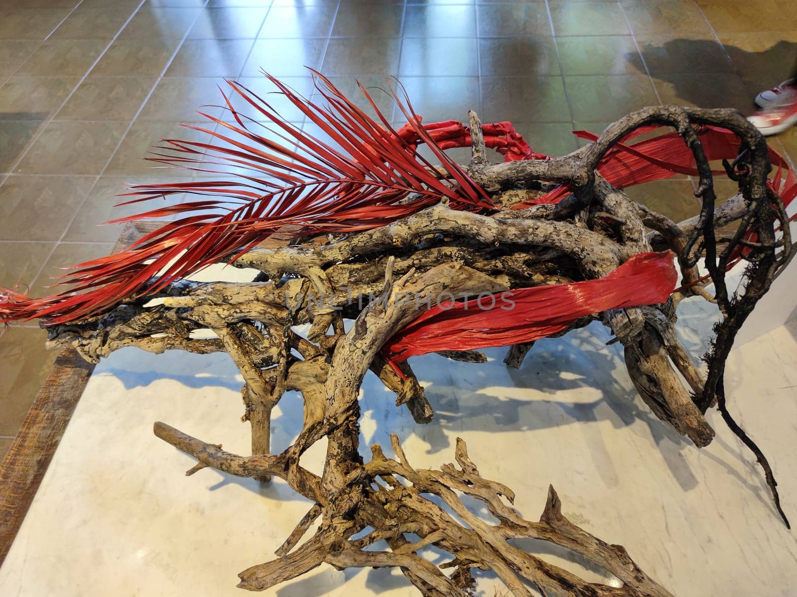 Japanese ikebana from dried flowers and red twigs.