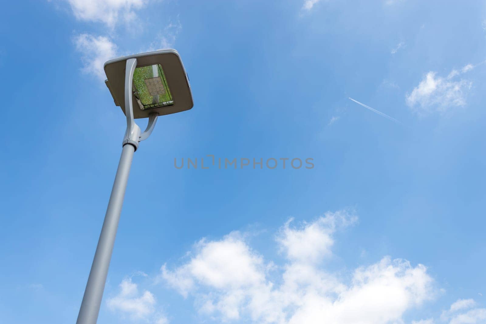 Led street lamp post isolated on blue sky background. Led lights saving electrical energy.