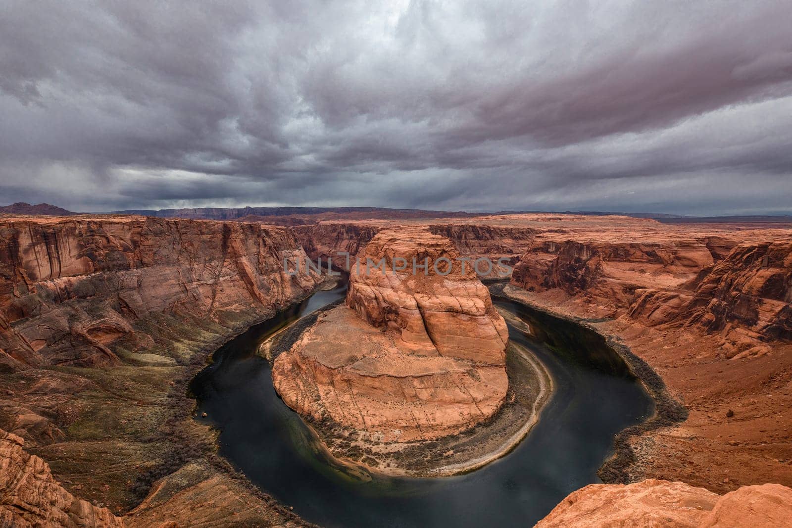 The Colorado River winds its way through the redrock sandstone at Horseshoe Bend, at Page, Arizona