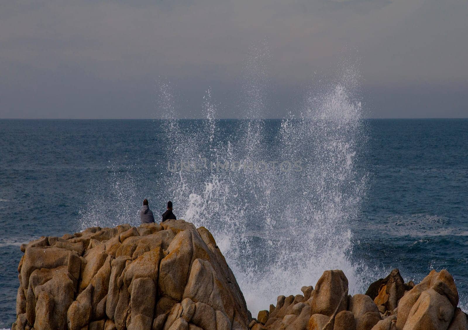 Powerful waves crash upon the beach along the Pacific Ocean at Monterey, California