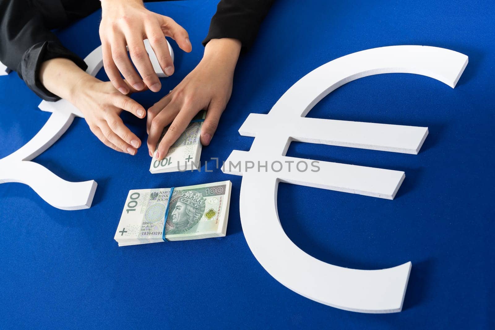 Many hands reach for banknotes handed out by government institutions to individuals and companies affected by the crisis due to the coronavirus.