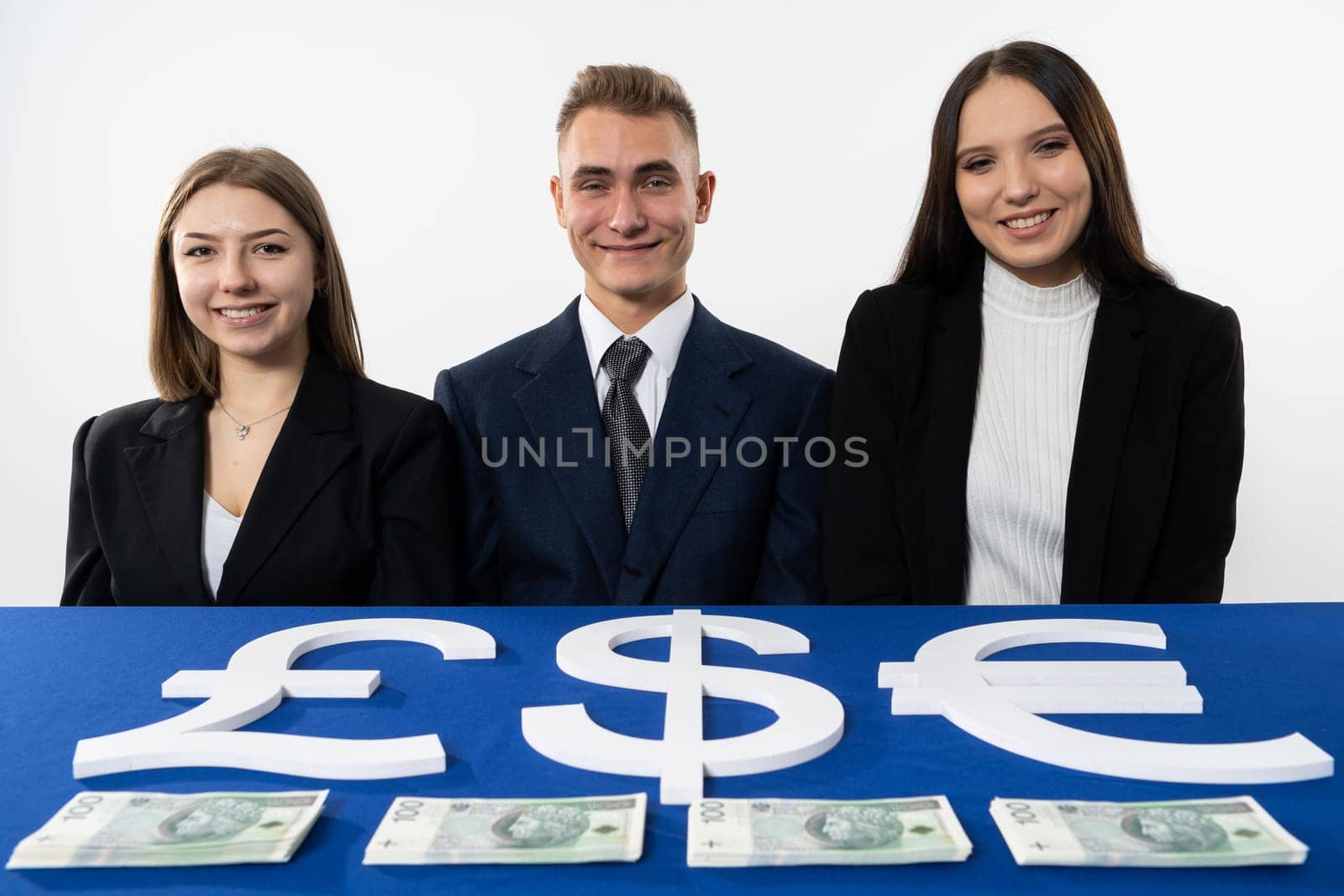 Two young girls and one boy as a committee scald to split the allocated funding to the school sector.