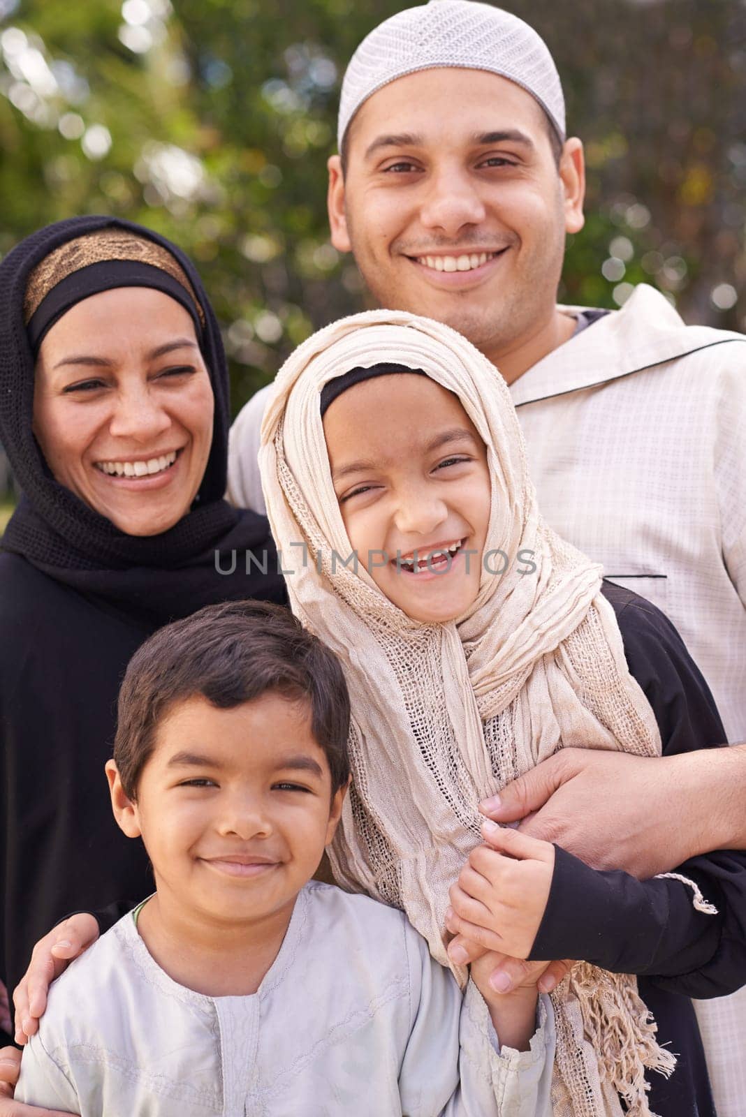 Park, muslim family and portrait of parents with children for bonding, ramadan and outdoors together. Islam, happy people and mother or father with kids for love, childcare and support in nature.