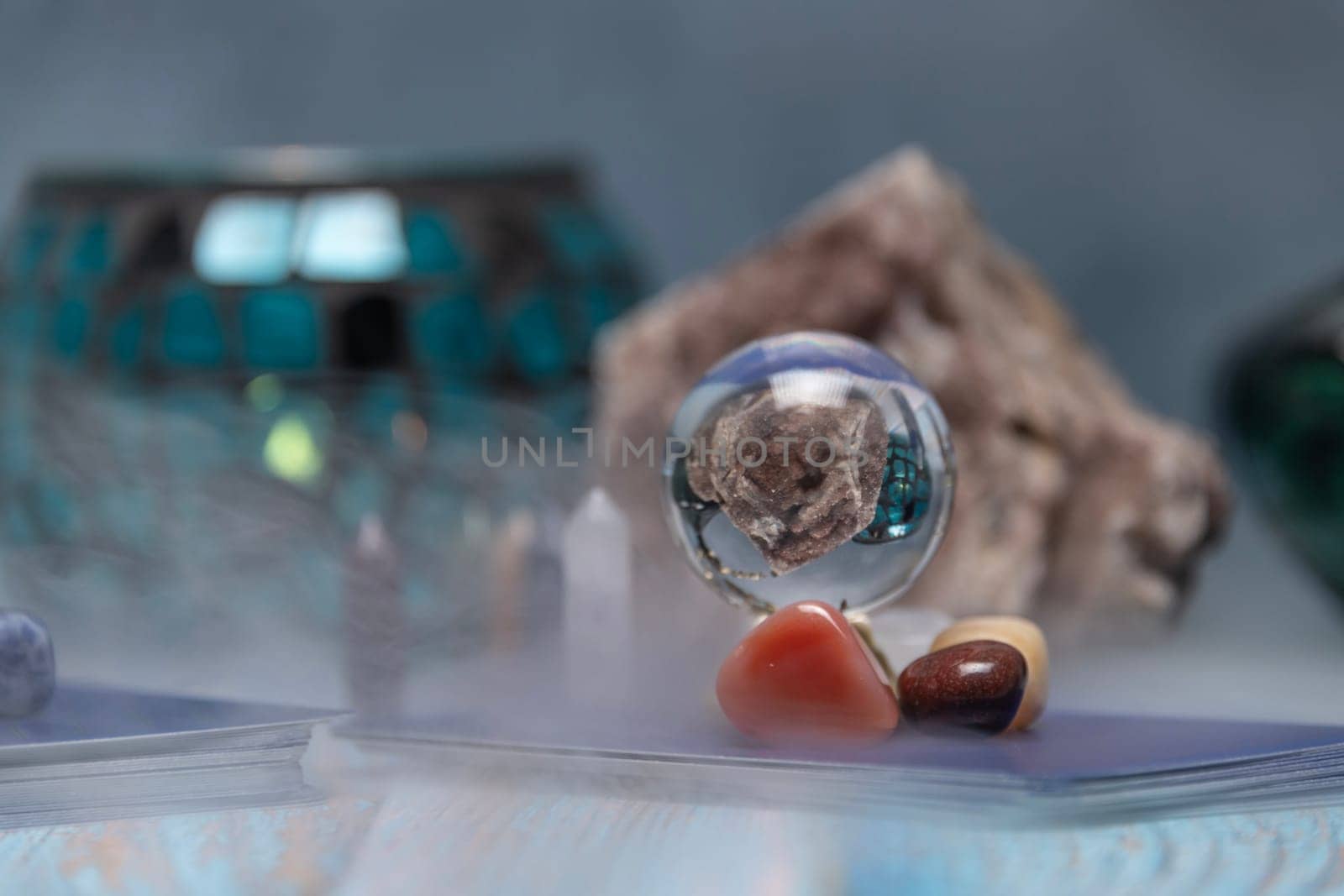 Fortune Telling Table with a crystal ball and tarot cards. by jbruiz78