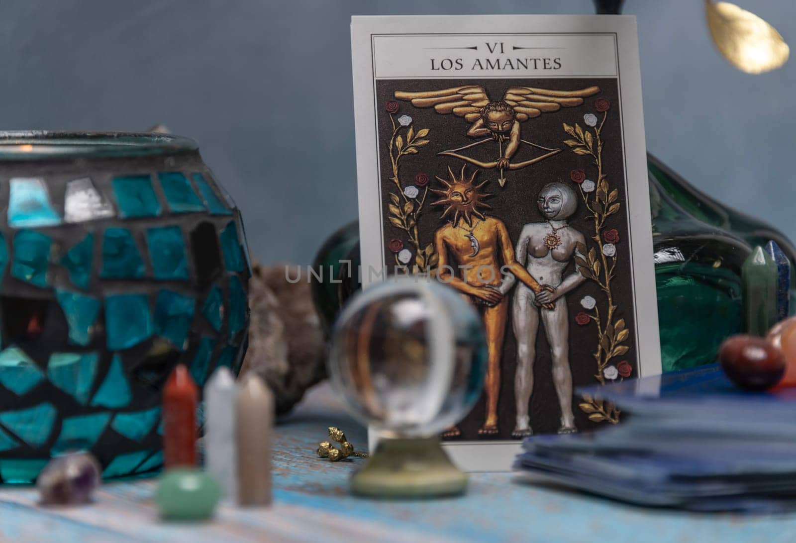 Cartomancy - Pendulum On Blurred Altar With Defocused Tarot Cards. by jbruiz78