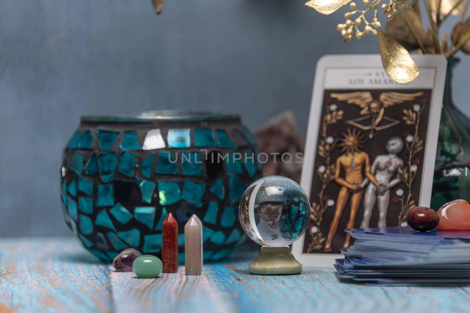 Cartomancy - Pendulum On Blurred Altar With Defocused Tarot Cards