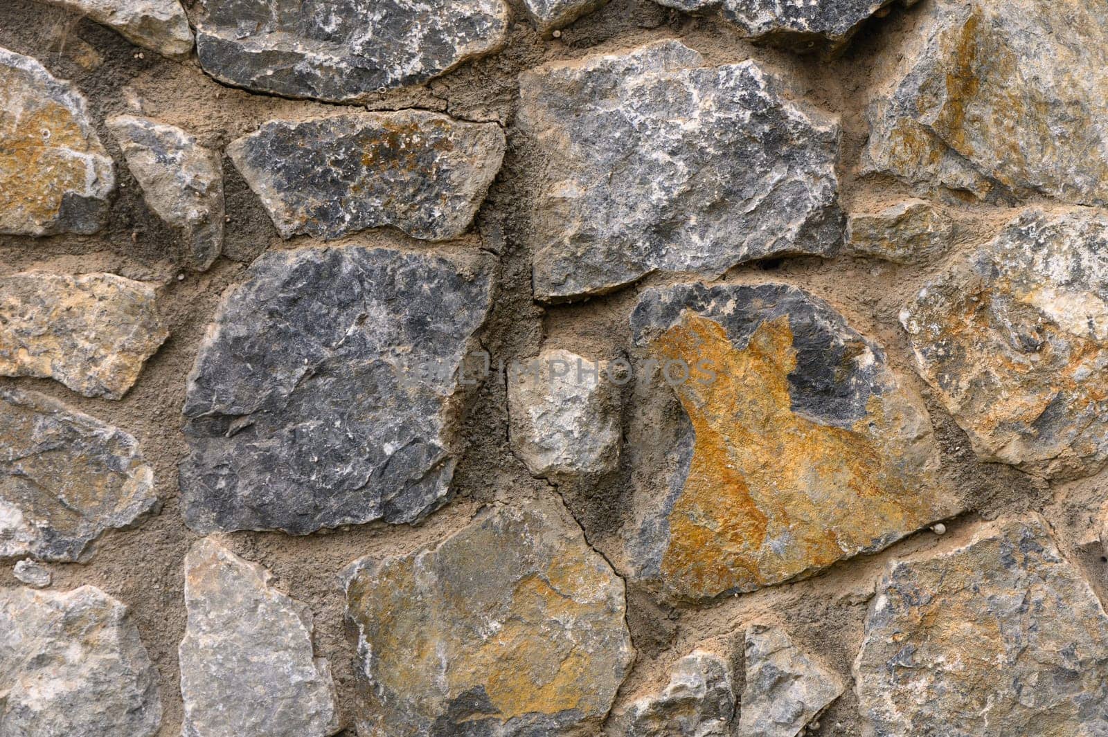 Stone wall as a background or texture. Part of a stone wall, for background or texture 2