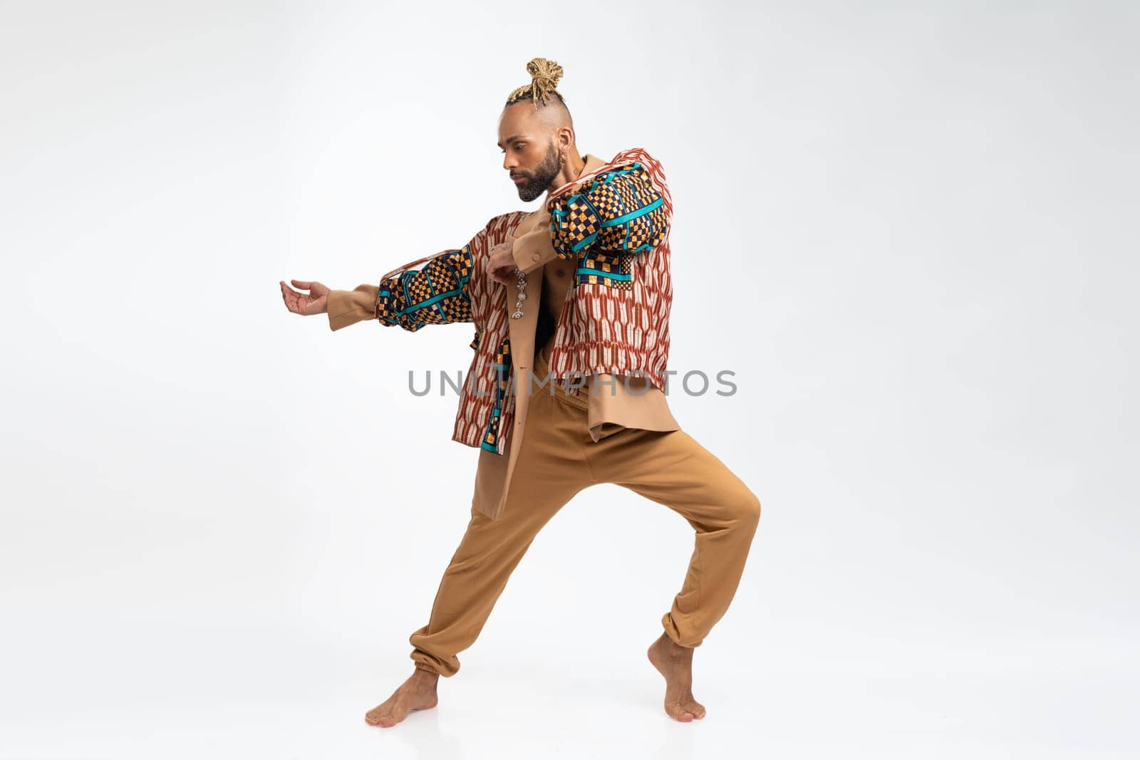 Gay man dancing in photo studio by andreonegin
