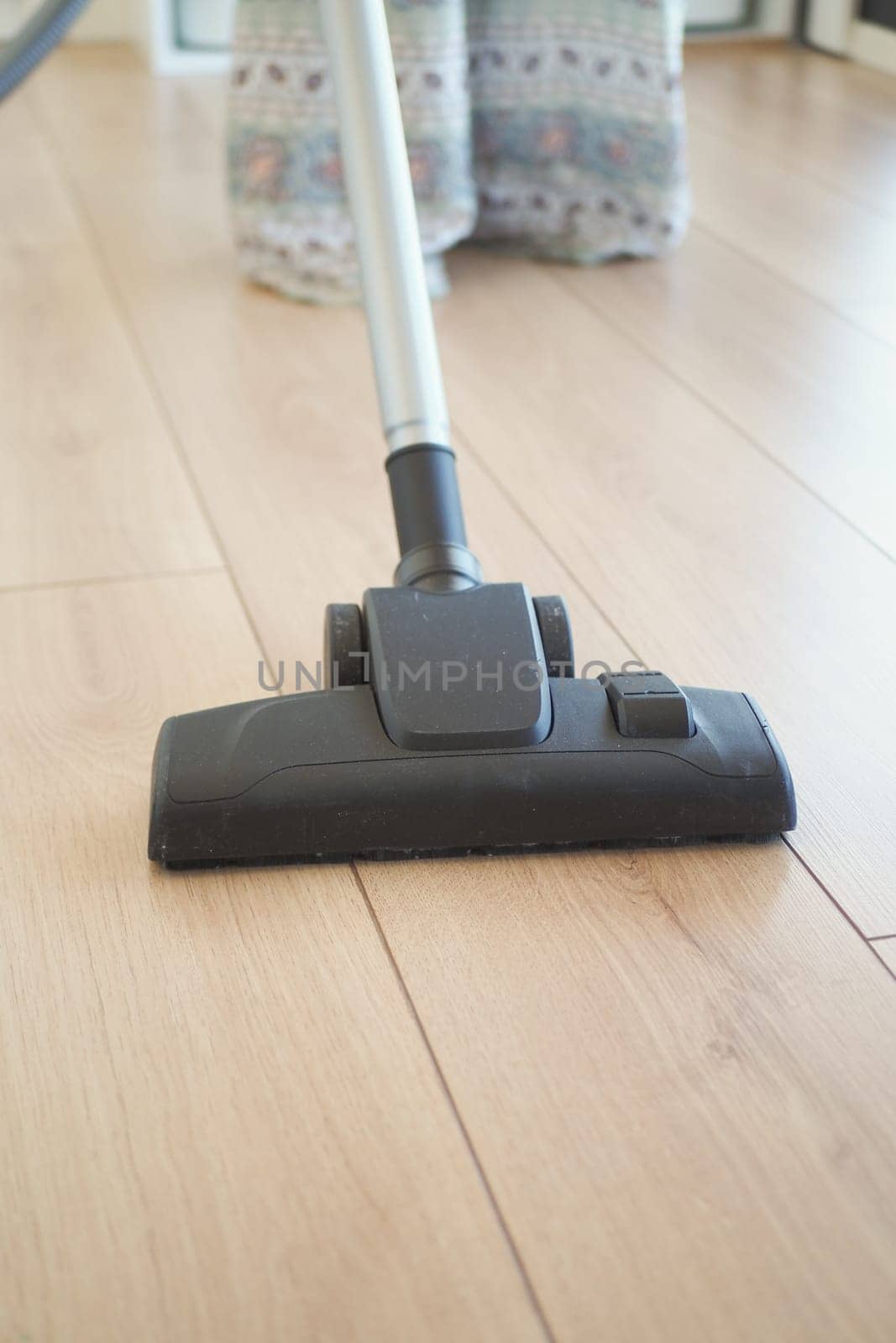 woman cleaning floor dust with vacuum cleaner