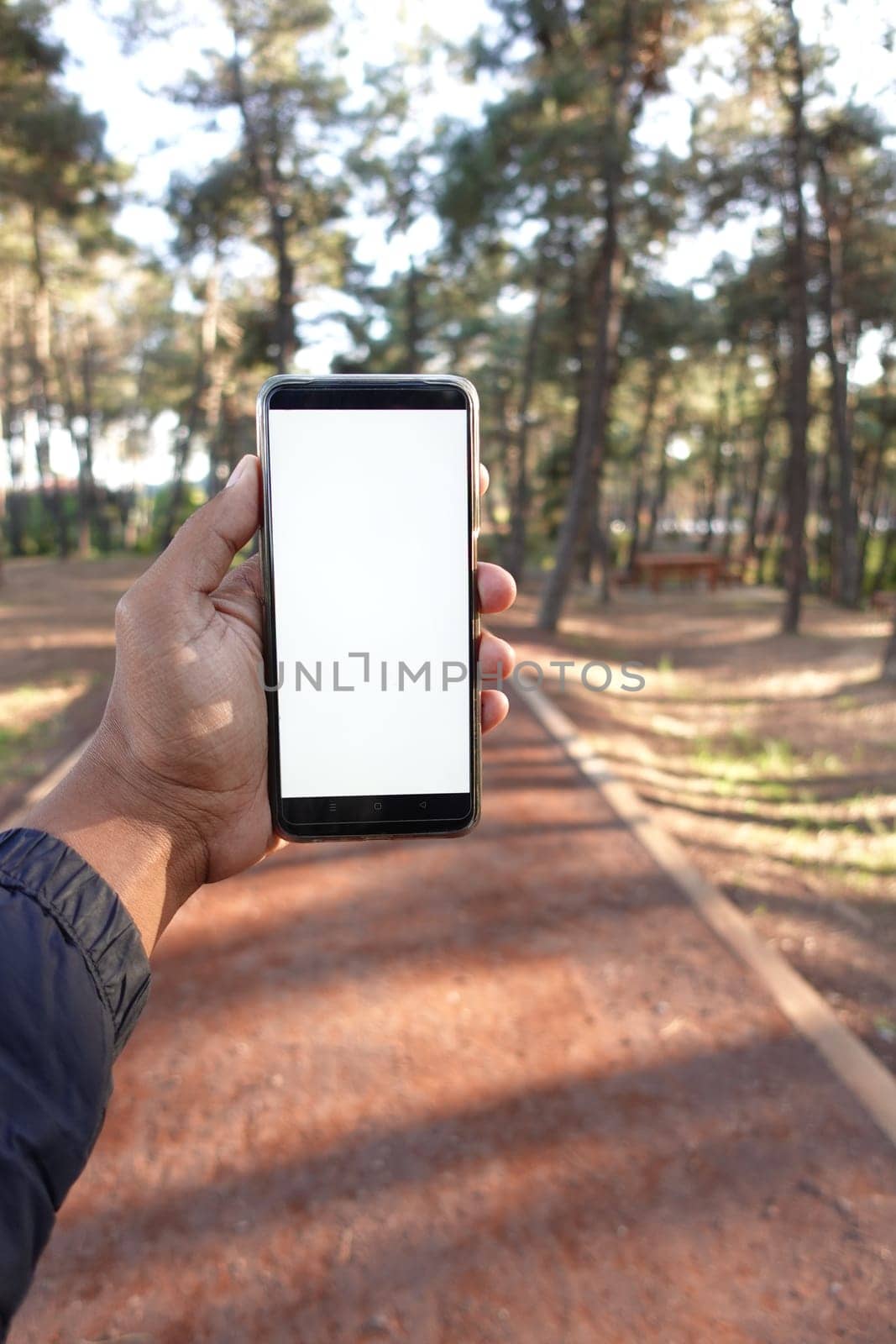 pov of young man using smart phone at outdoor ,