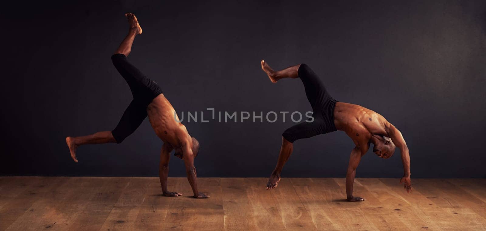 Movement, dancer and contemporary in studio for acrobatics, competition and training. Composite, balance and young black man for professional, performance arts and workout with dark background by YuriArcurs
