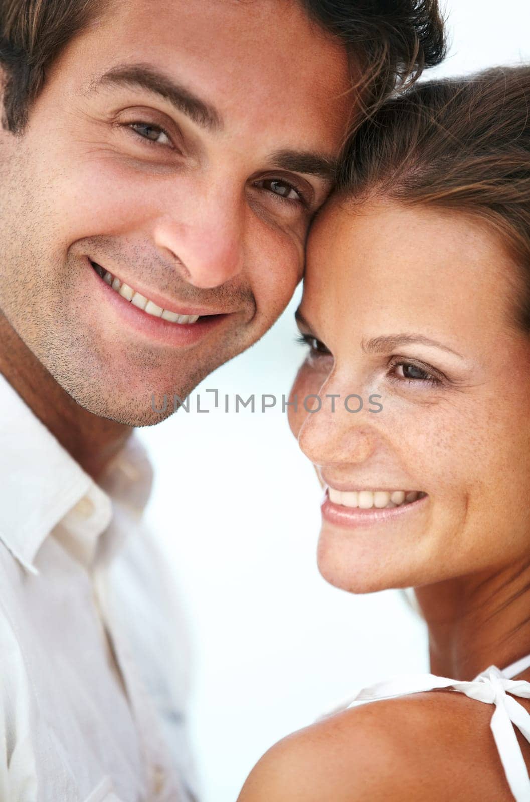 Happy couple, portrait and love in outdoor for romantic and travel on honeymoon by sky background. Man, woman and smile face for bonding together with care, peace and trip for commitment in marriage.