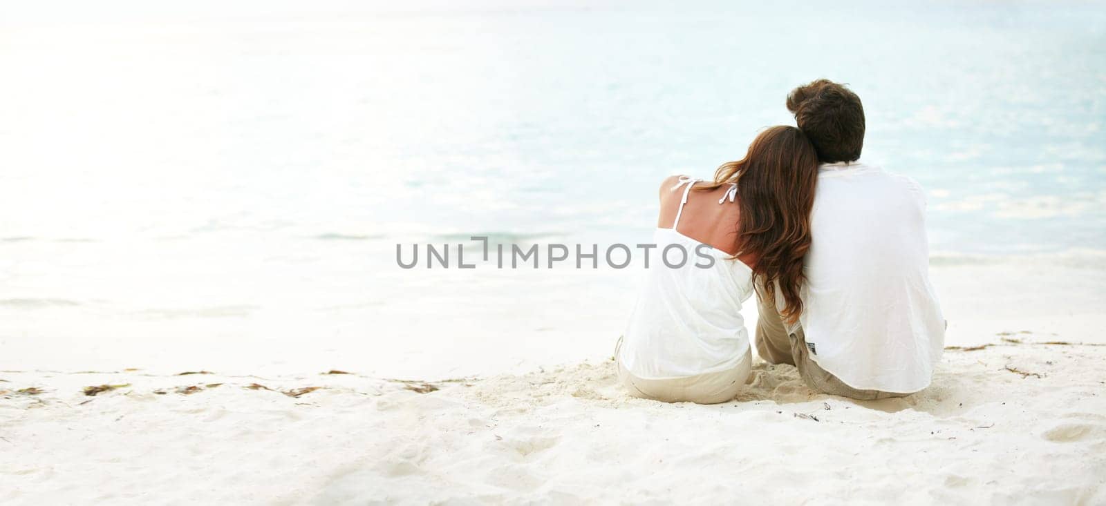 Young couple, back and love at beach outdoors for mockup, relationship and marriage. Calm, man and woman with space for support, care and flare on holiday or vacation together in nature for travel.