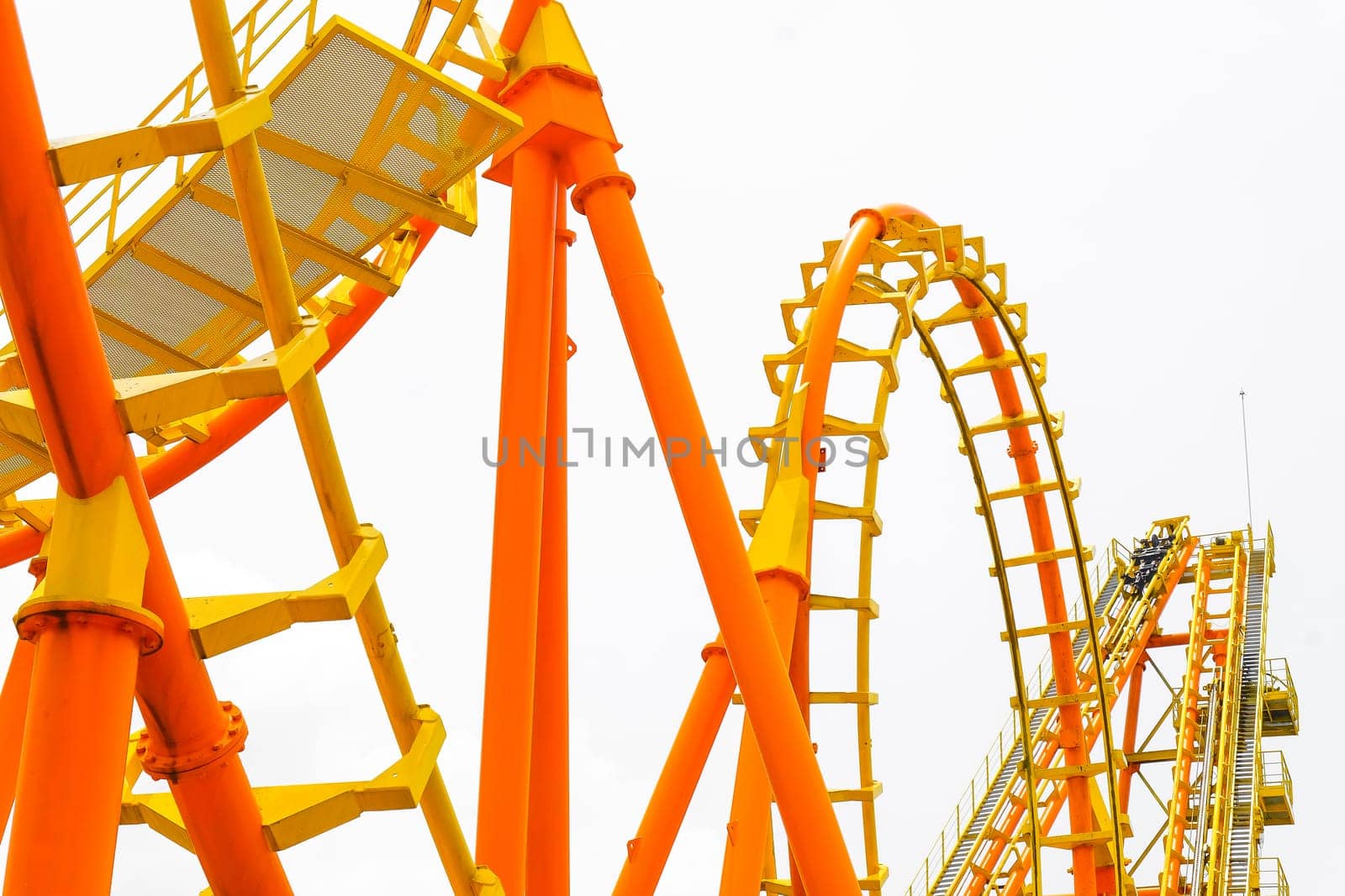 Rollercoaster on white background, closeup of photo.