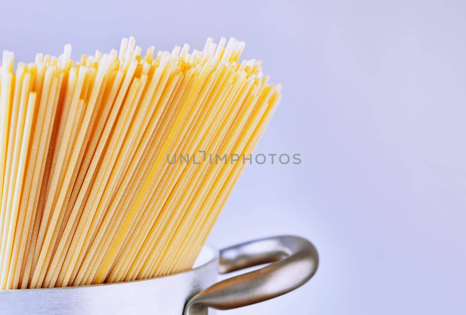 Dried pasta spaghetti in pan , preparing food , traditional italian food