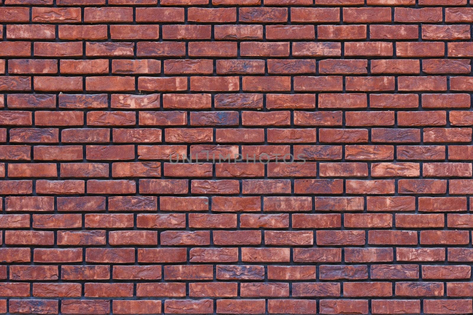 close up of a red brick wall - full-frame background and texture.