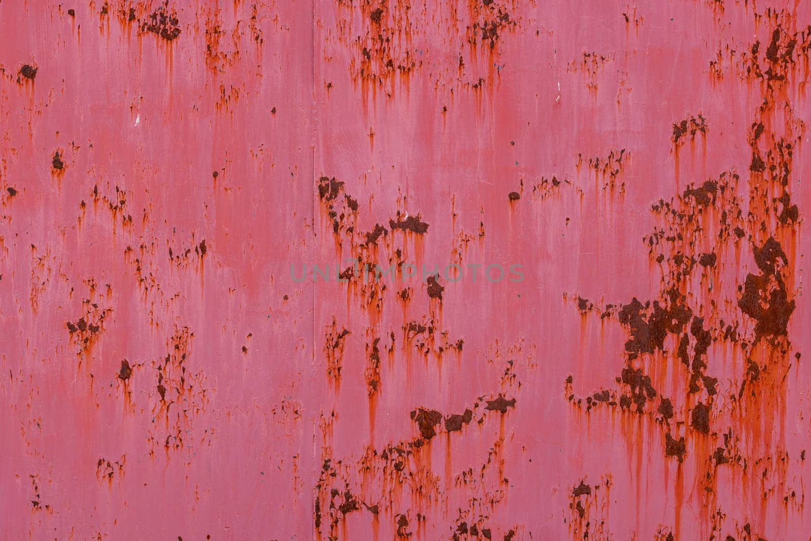 rusty red sun faded paint on flat sheet metal surface full-frame background and texture by z1b