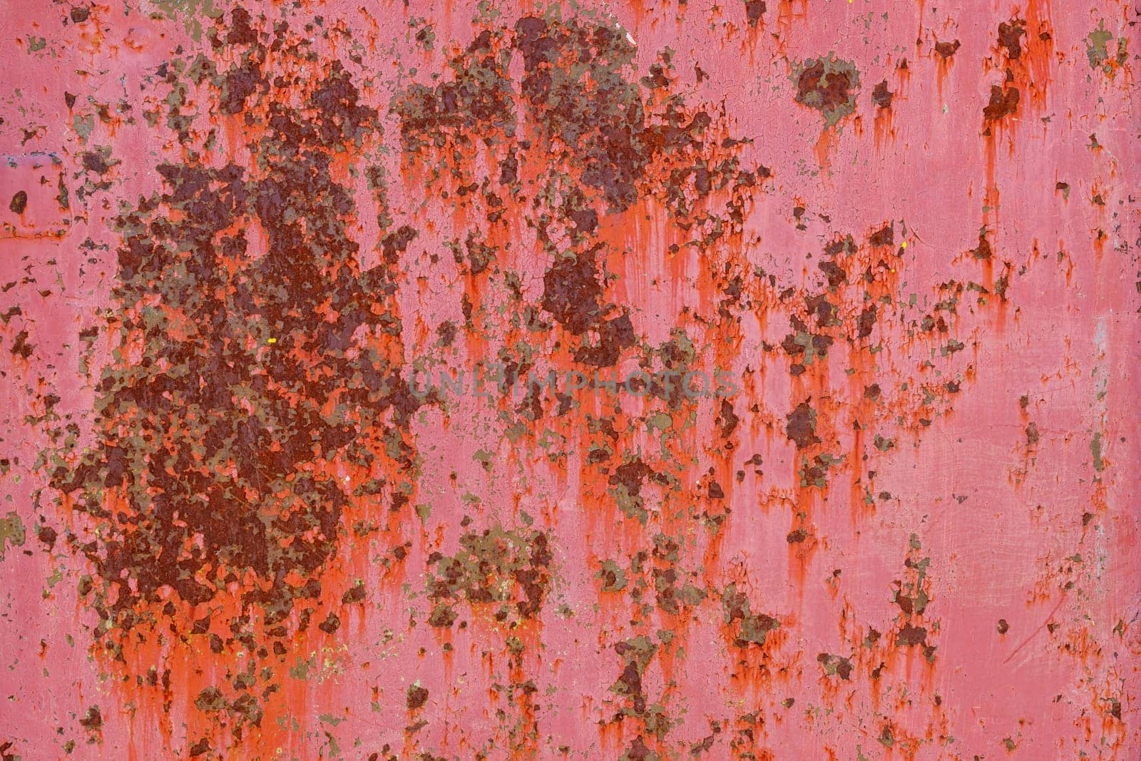 rusty red sun faded paint on flat sheet metal surface full-frame background and texture by z1b