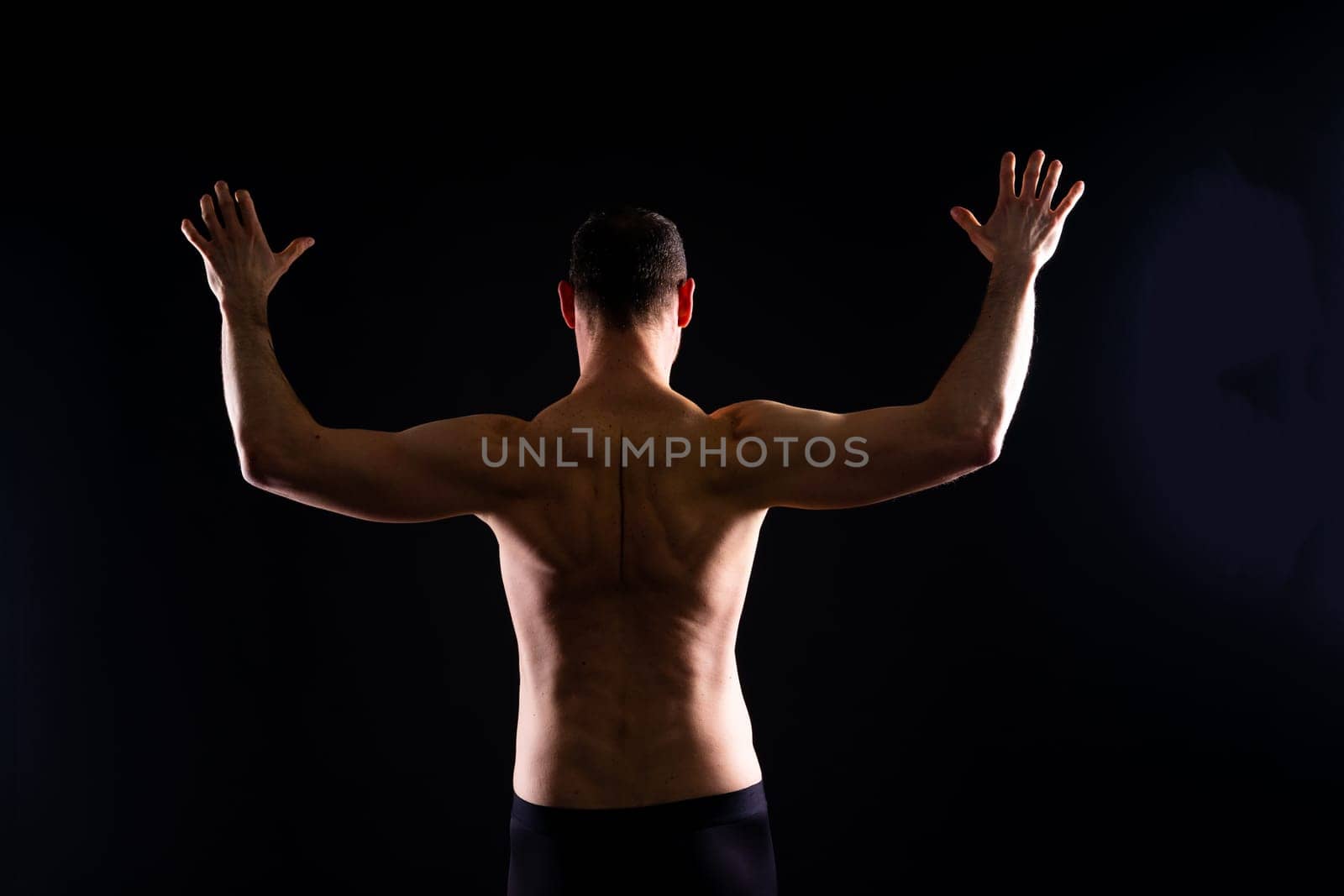 Portrait of man, bodybuilder and bicep flex in studio, background and exercise for muscular power. by Zelenin