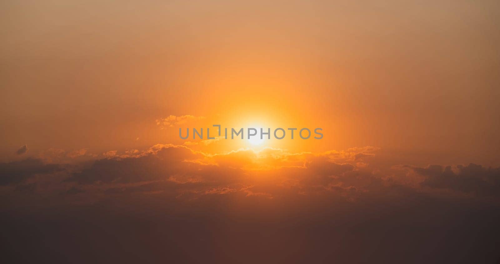 Gorgeous panorama scenic of the strong sunrise with cloud on the orange sky