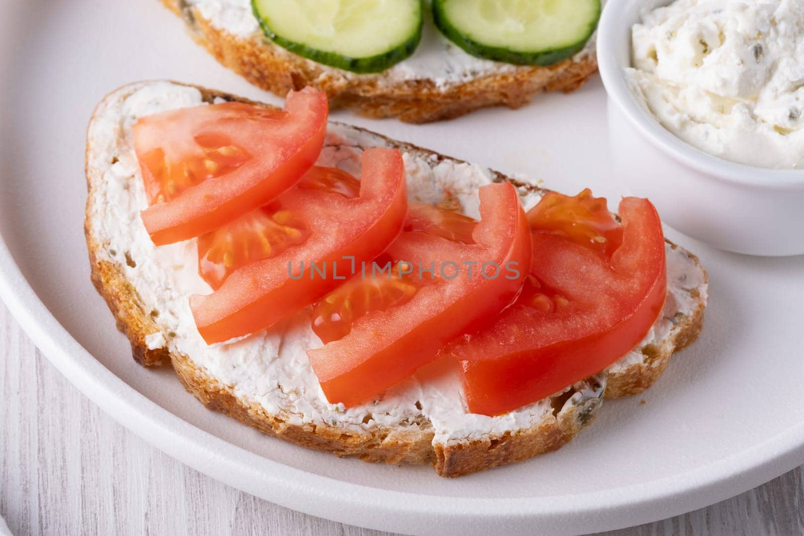 Olive bread with cottage cheese and tomatoes by NataliPopova