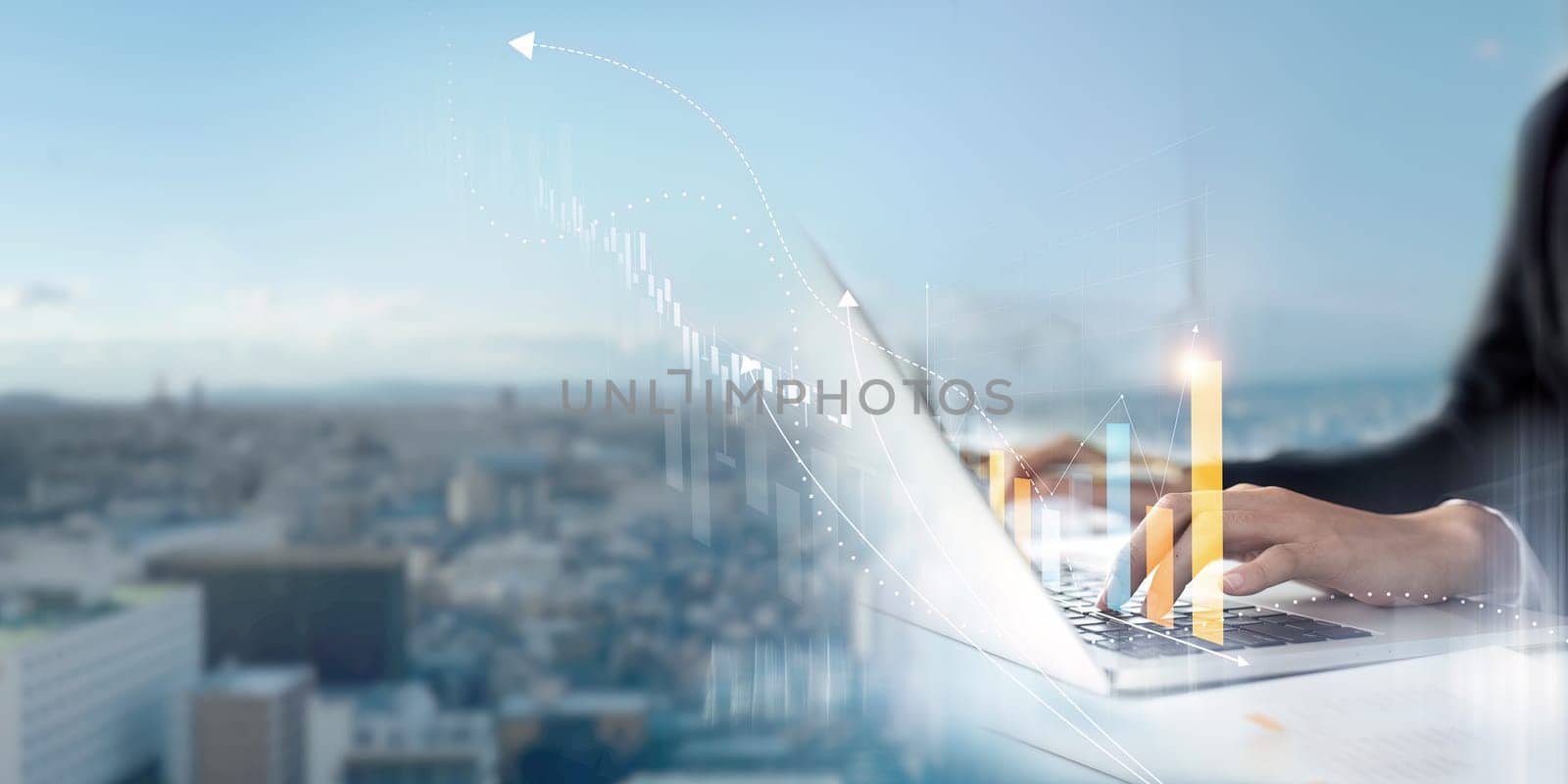 A person is typing on a laptop in front of a city skyline. Concept of productivity and focus, as the person is working on a task in a busy urban environment