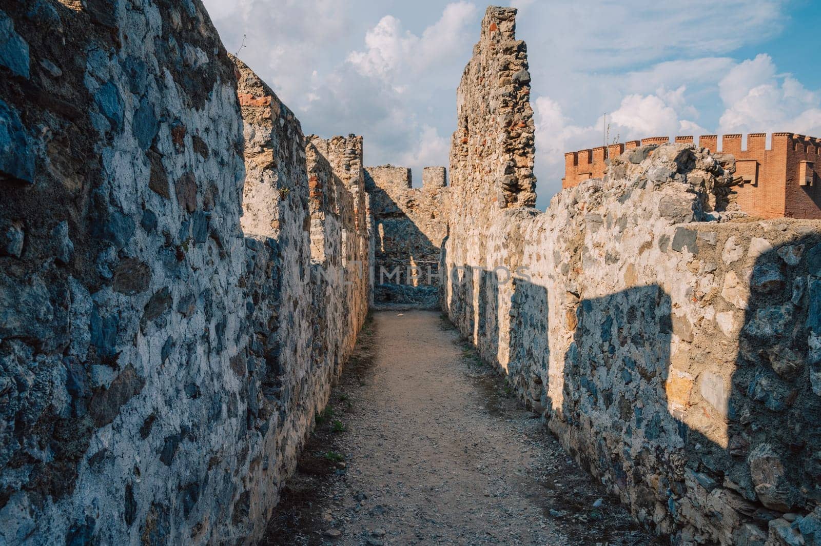 Fortress ruins of the historical Red Tower - Kizil Kule, in Alanya Castle. The Red Tower is the symbol of the Alanya city, and the famous touristic place, Turkey (Turkiye).