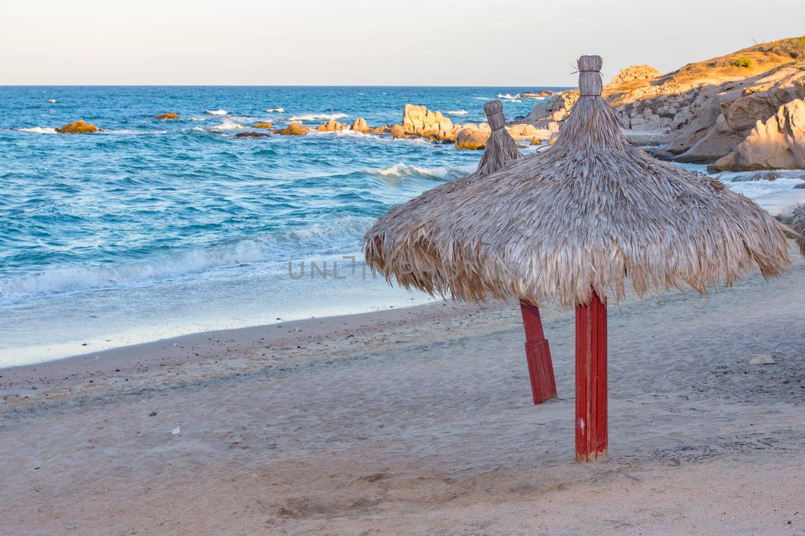 sun umbrella at Cabo Pulmo Baja California national park panorama by AndreaIzzotti